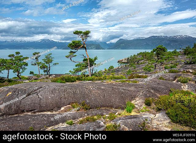 Norway, Vestland, View of Hardangerfjord with mountains in background