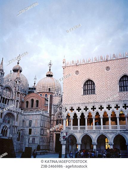 Saint Mark's Basilica left and the Doge's Palace or Palazzo Ducale right at dusk, St Marks Square, Venice, Italy, Europe