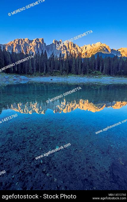 Italy, Trentino South Tyrol, Bolzano, the alpine lake of Carezza / Karersee with the Latemar mountain range, Dolomites