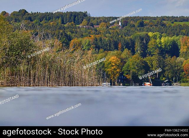 District Starnberg, Germany October 04, 2020: Impressions Starnberger See - 2020 View from Hoehenrieder Park to Unterzeismering and above the Nikolauskircherl...