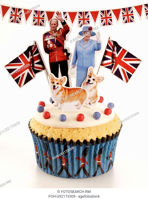 Royal Themed British Celebration Cupcake, White Iced Sponge Fairy Or Cup Cake, Topped With Red And Blue Sprinkles Two Small Union Jack Flags
