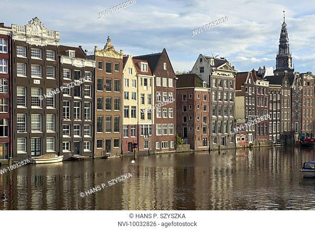 Houses at the Damrak with the Oude Kerk church, Amsterdam, North Holland, Netherlands