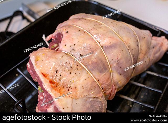 Leg of lamb stuffed and trussed in preparation for roasting