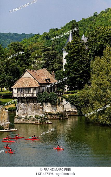 Kayakers on the Seine, ancient mill and the rooftops of Chateau des Tourelles, Vernon, Normandy, France