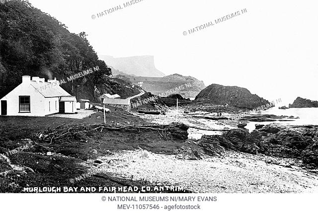 Murlough Bay and Fair Head, Co. Antrim - a view along the shore with a building to the left, to Fair head in the distance(copy negative)