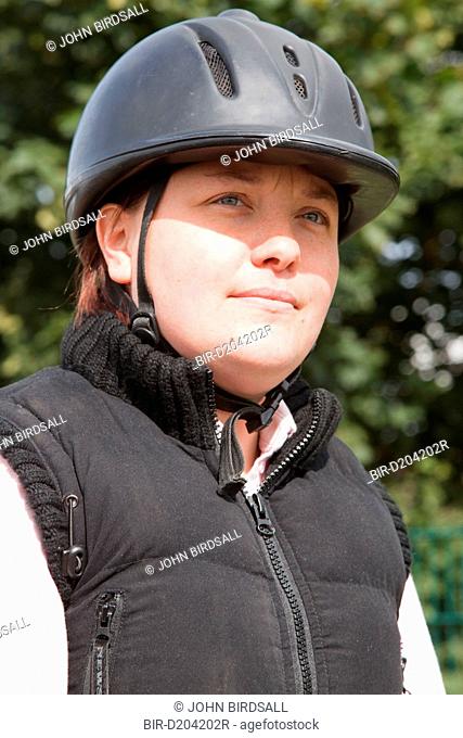 Portrait of woman with visual impairment having riding lesson