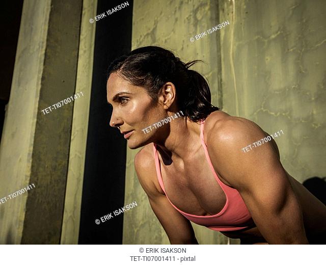Woman resting during exercise