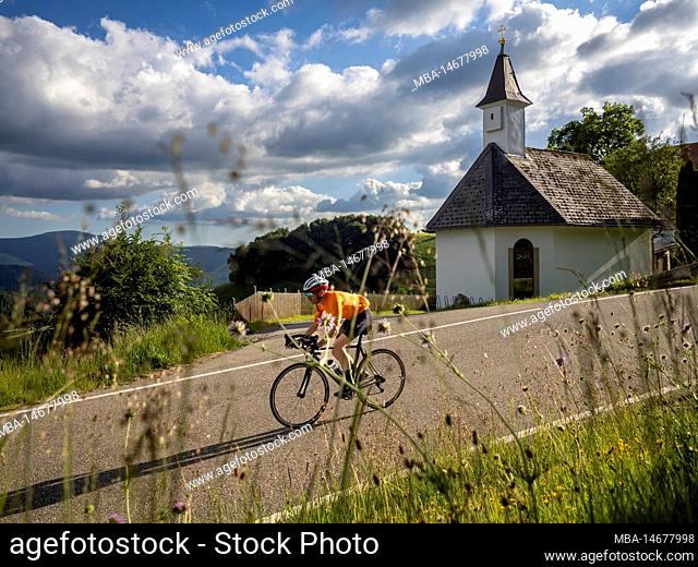 Road cyclist on district road near Münstertal at Schauinsland, Hofkapelle near Giesshübel inn, Stohren
