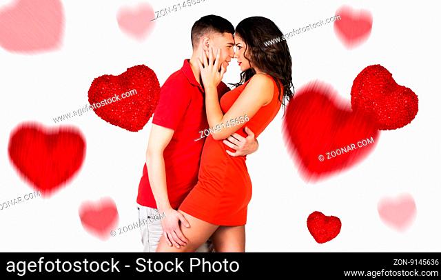 Young couple hugging and falling hearts isolated on white background
