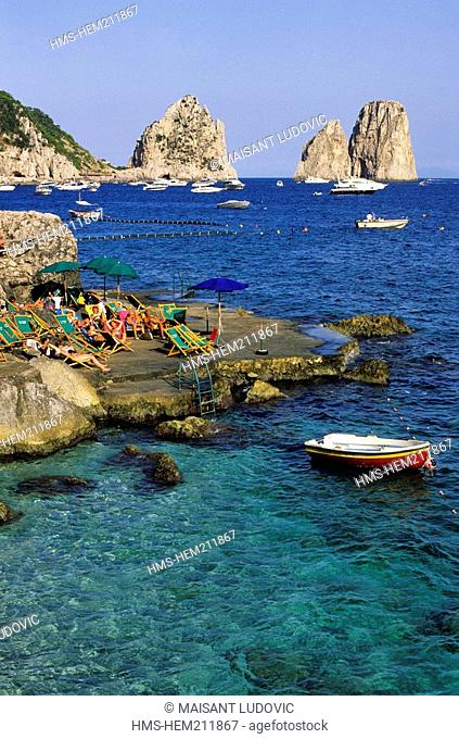 Italy, Campania, Capri Island, Marina Piccola with Faraglioni Rocks in the background