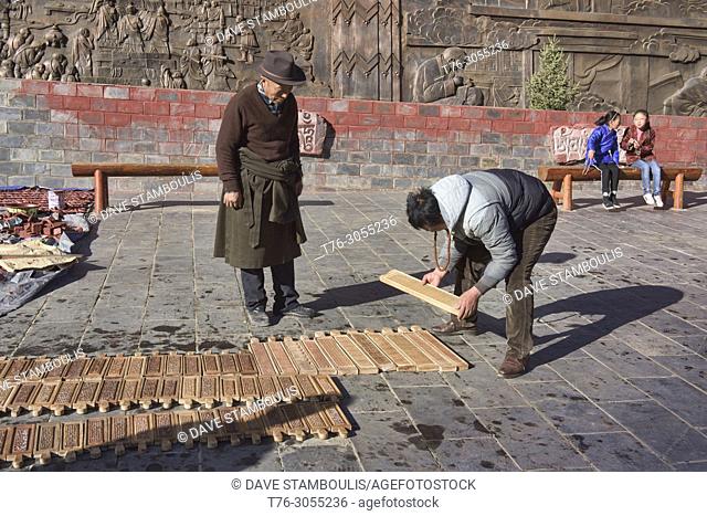 Drying Tibetan woodblock prints at the holy Bakong Scripture Printing Press Monastery in Dege, Sichuan, China