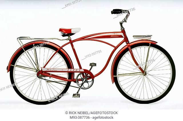 Vintage red and white 1950's-era bicycle; white background