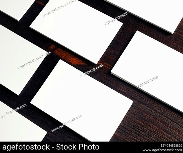 Photo of blank white business cards on wooden background. Copy space for placing your design