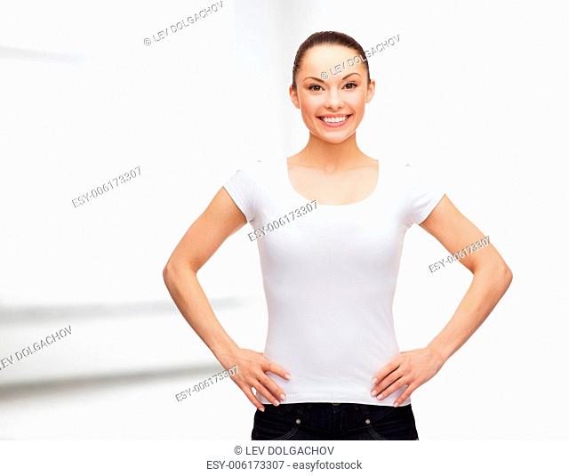 t-shirt design concept - smiling woman in blank white t-shirt