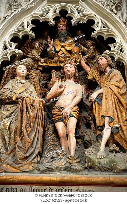 Gothic sculptures depicting John The Baptist baptsisng Christ. Cathedral of Notre-Dame, Amiens, France