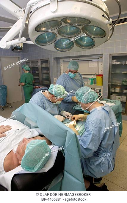 Vascular surgery, surgery on the hand with local anesthesia, operating room in the hospital, Düsseldorf, North Rhine-Westphalia, Germany