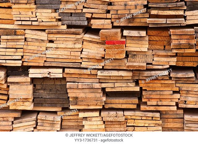 Stacked boards at recycling business, Michigan, USA