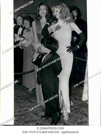 Dec. 12, 1974 - Little Man You Have A Busy Night: The cigar-smoking French actor Herve Villechaize and lovely actresses, Britt Ekland (right) and Maud Adams