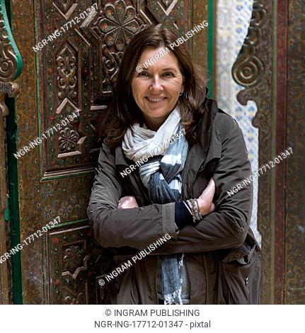 Woman standing at the doorway of Kasbah of Glaoui, Telouet, Ouarzazate, Souss-Massa-Draa, Morocco