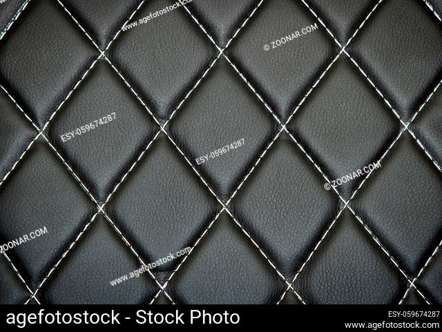 Genuine leather upholstery background for a luxury decoration in black tones