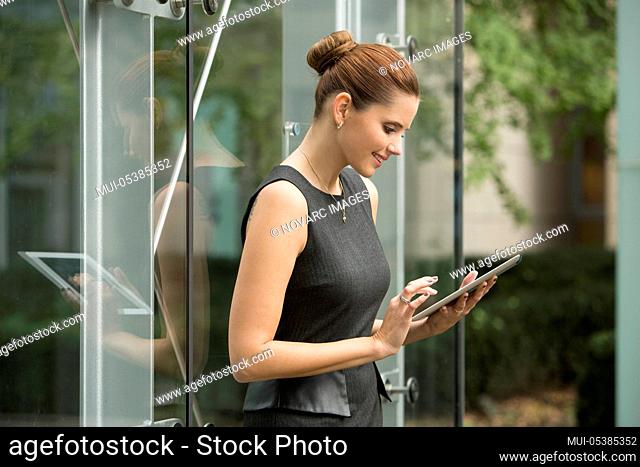 Young businesswoman using tablet pc