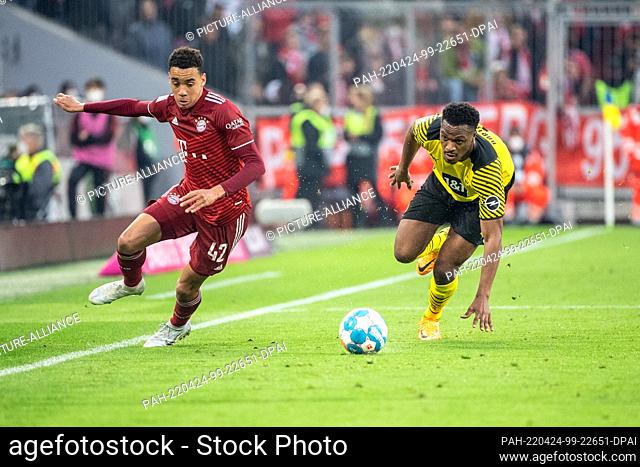 23 April 2022, Bavaria, Munich: Soccer: Bundesliga, Bayern Munich - Borussia Dortmund, Matchday 31, Allianz Arena. Jamal Musiala of FC Bayern München (l) and...