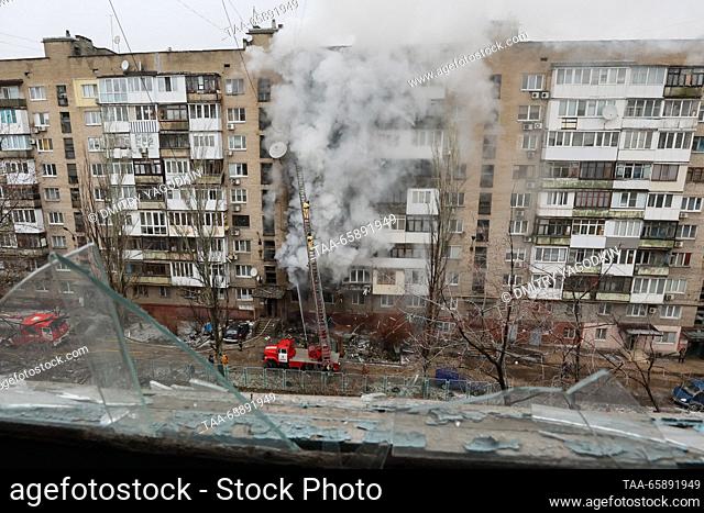 RUSSIA, DONETSK - DECEMBER 19, 2023: Firefighters battle a fire at an apartment block after shelling in the Kiyevsky neighbourhood