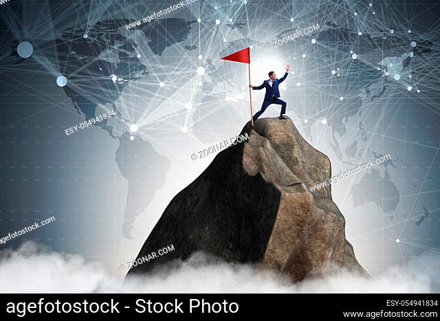 Businessman at the top of mountain