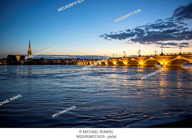 France, Bordeaux, historic bridge Pont de Pierre over the Garonne river at sunset