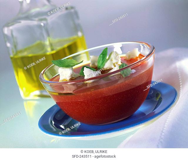 Tomato jelly with sheep's cheese and basil, olive oil