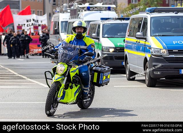 01 May 2022, Bavaria, Nuremberg: Police Chief Koumantzias rides his emergency vehicle, an electric motorcycle, during a demonstration