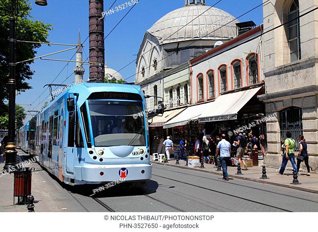 Turkey, Istanbul (municipality of Fatih), district of Cemberlitas, the tram in the street Divan yolu and the column of Constantine (Cemberlitas)