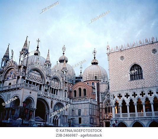 Saint Mark's Basilica left and the Doge's Palace or Palazzo Ducale right at dusk, St Marks Square, Venice, Italy, Europe