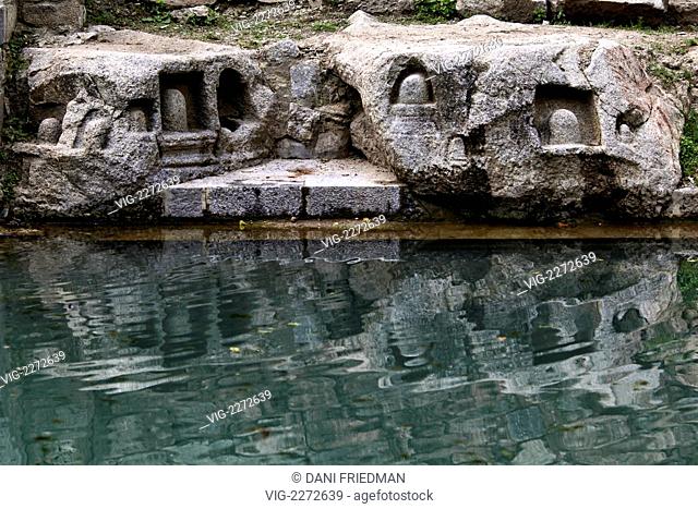 Shiva Lingas carved into solid rock by the holy spring at Narayan Nag. Nararyan Nag when translated means 'God's own spring'