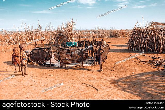 Omorate, Omo Valley, Ethiopia - May 11, 2019: Children from the African tribe Dasanesh in village. Daasanach are Cushitic ethnic group inhabiting in Ethiopia