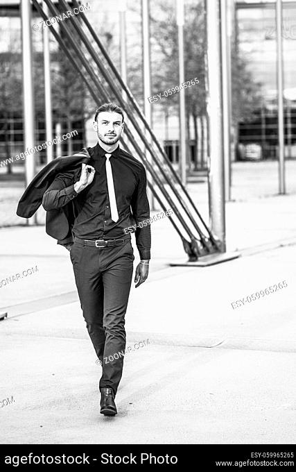 Handsome stylish young businessman posing portrait outdoor
