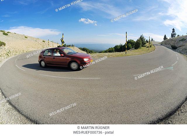 France, Provence, Vaucluse, Car passing through curve road