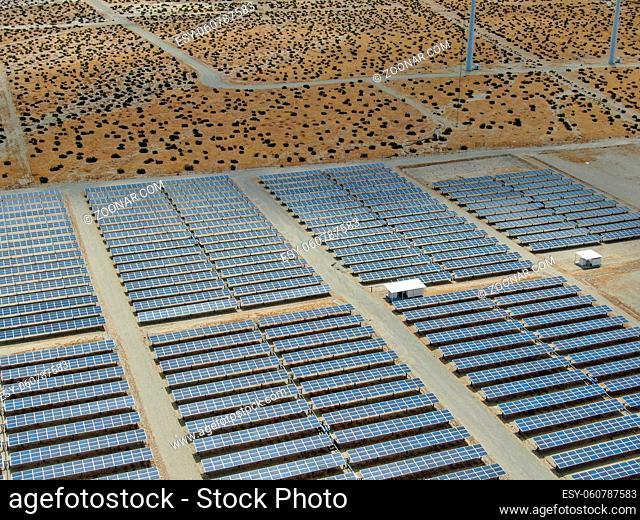 Aerial view of Genuine Energy Farm in the Hot Arid Desert of Palm Springs, California. Solar Panels farm to Harness the Power of Nature to generate free green...