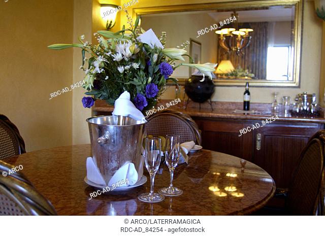 Laid table with champagne and flowers in bridal suite of Palace Hotel luxory hotel Sun City South Africa
