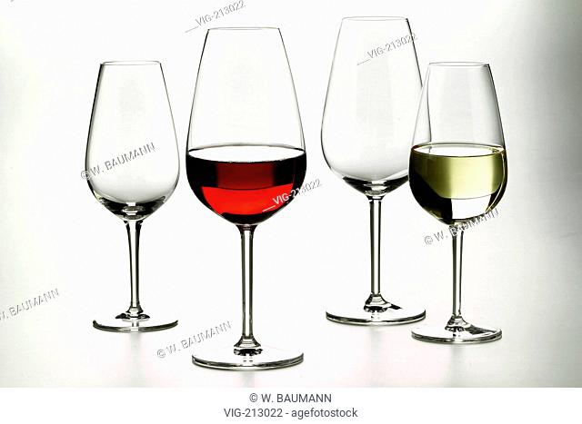 Four wine glasses, one filled with red, another with white wine. - 01/01/2006