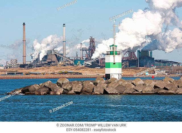 Big steel factory with harbor at the Dutch coast