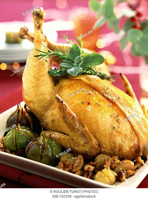Capon with stuffing and roast figs