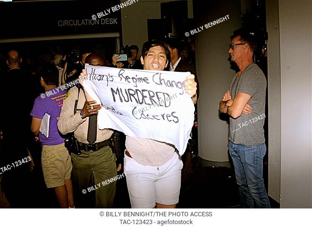 Protester at Presidential candidate Hillary Clintons campaigns at Grassrooots Organizing Event for the California Democratic primary at Cox Library on the...