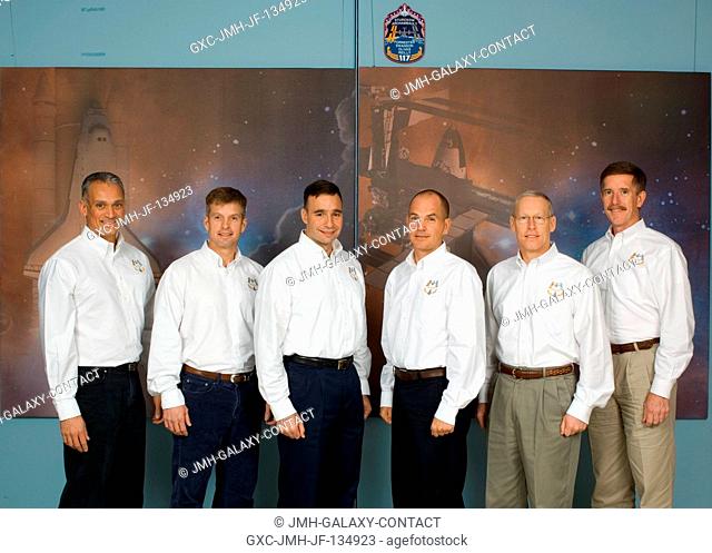 The STS-117 crewmembers pose for a portrait following a pre-flight press conference at Johnson Space Center. From the left are astronauts John Danny Olivas