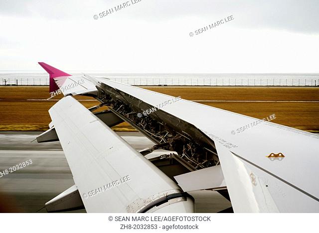 Flaps on an airplane extended during landing at the Kansai International Airport in Japan