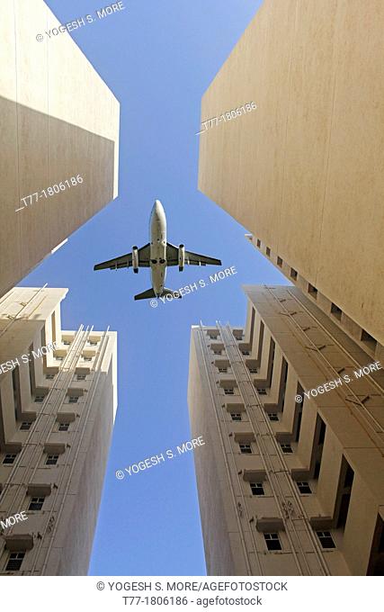 Airplane flying over a Building, Pune, Maharashtra, India