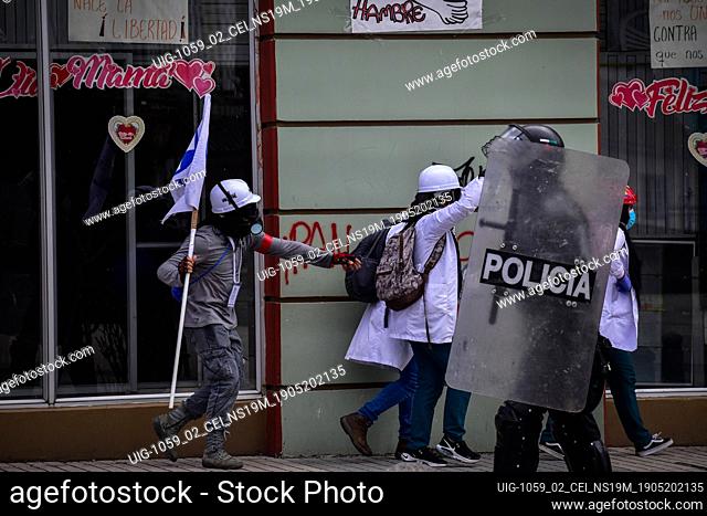 Medical brigade members assist in wounded demostratos during protests in Pasto, Narino on May 19, 2021 during an antigovernment protest against police brutality...