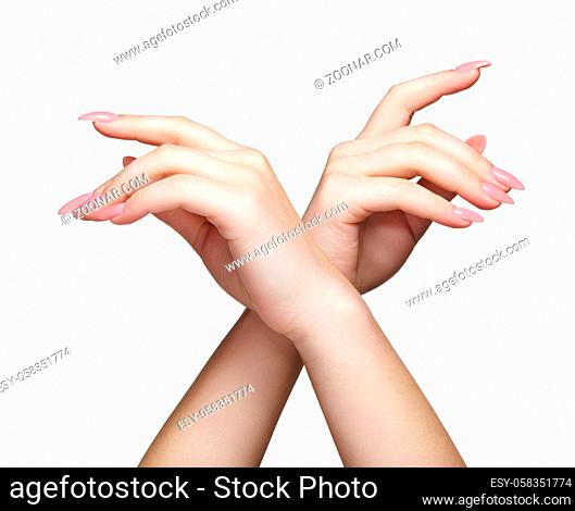 Female hands with woman's professional natural perfect nails manicure isolated on white background