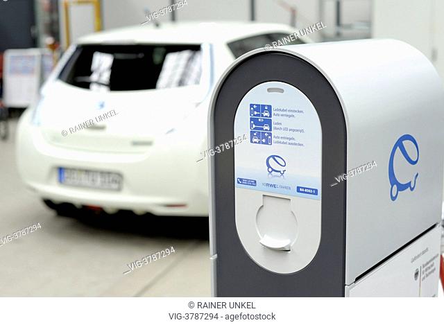 GERMANY, DORTMUND, An electric car Nissan Leaf is charged with electricity at Technical University Dortmund , the picture is showing a charging unit by RWE AG