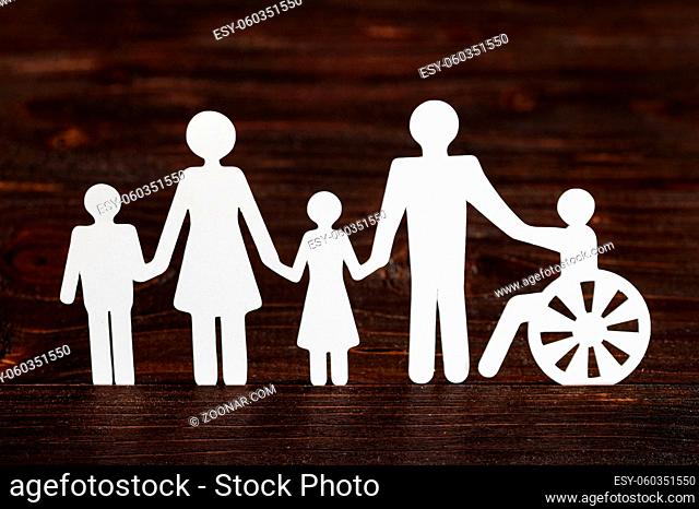cutout paper different family members wooden background